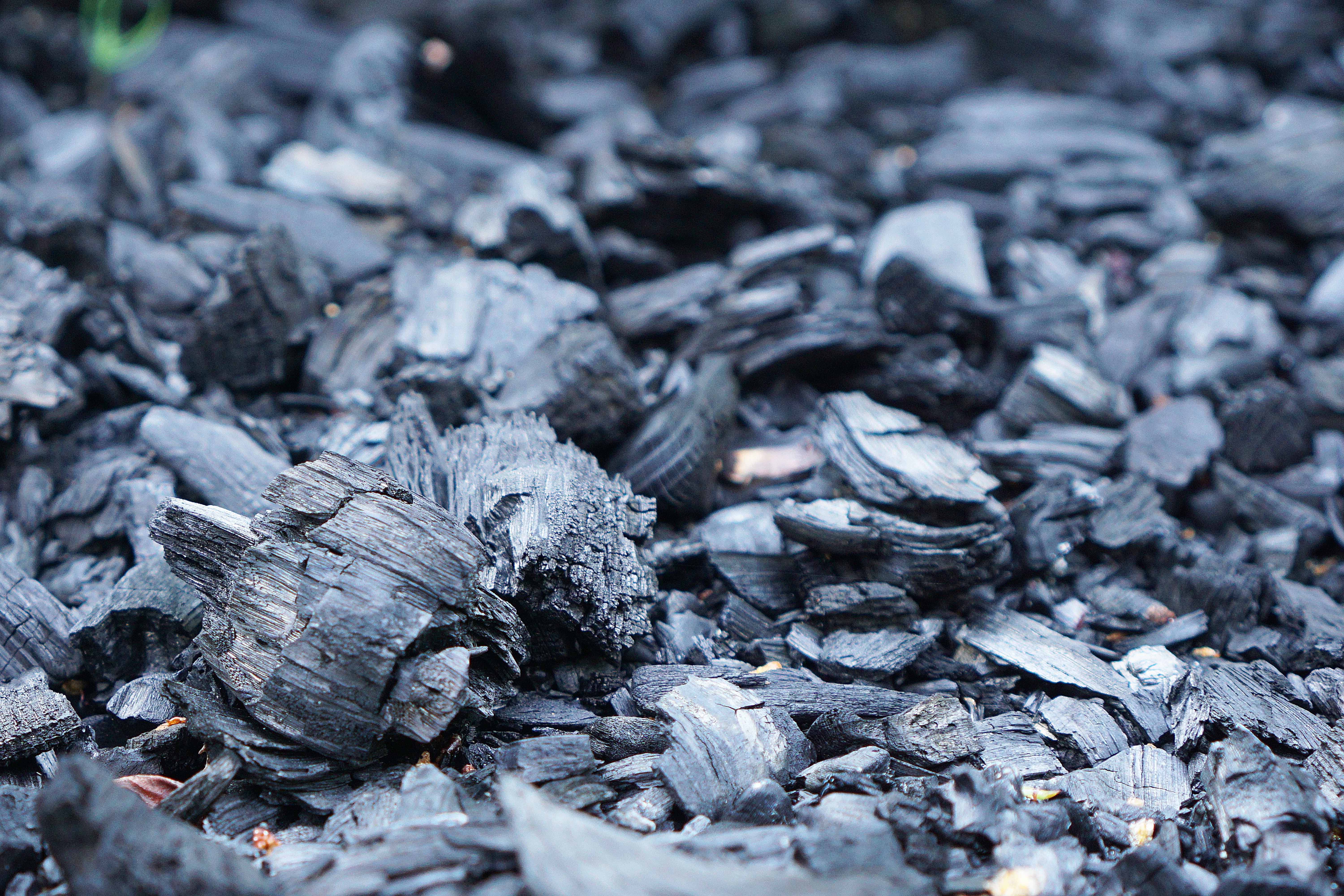 A close up of charcoal on a floor